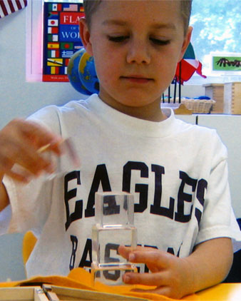 boy building with clear blocks