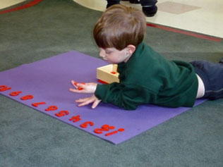 boy building with clear blocks